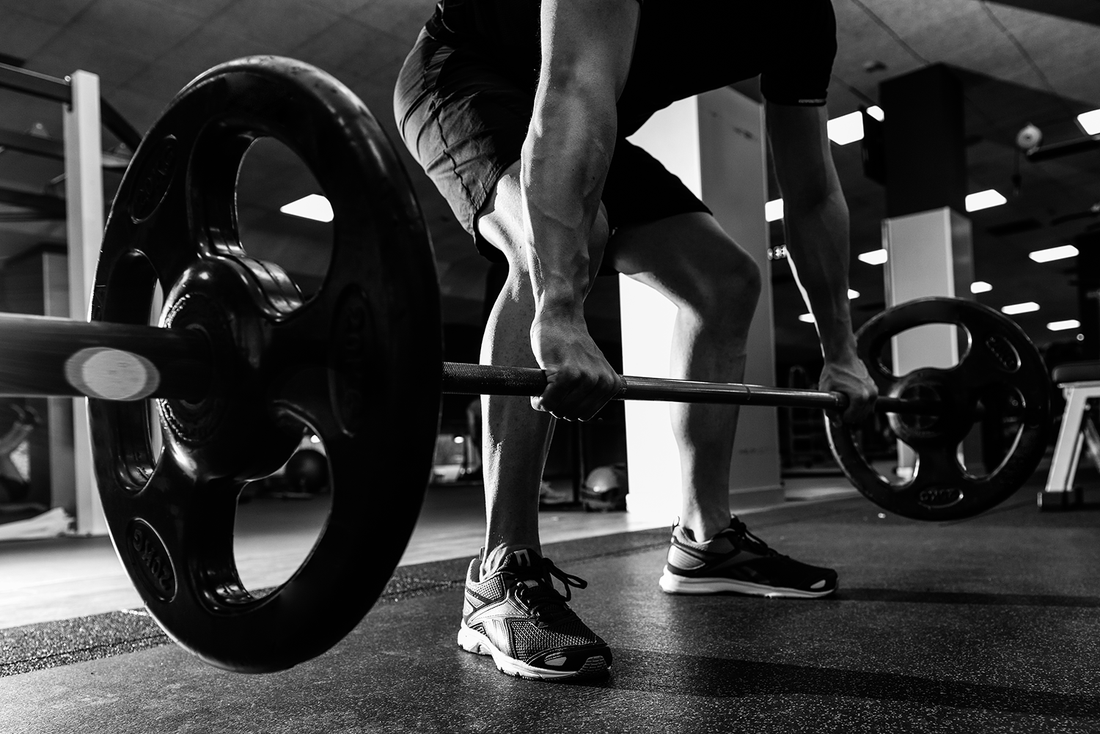 ''De rol van squats bij powerlifting en olympisch gewichtheffen''